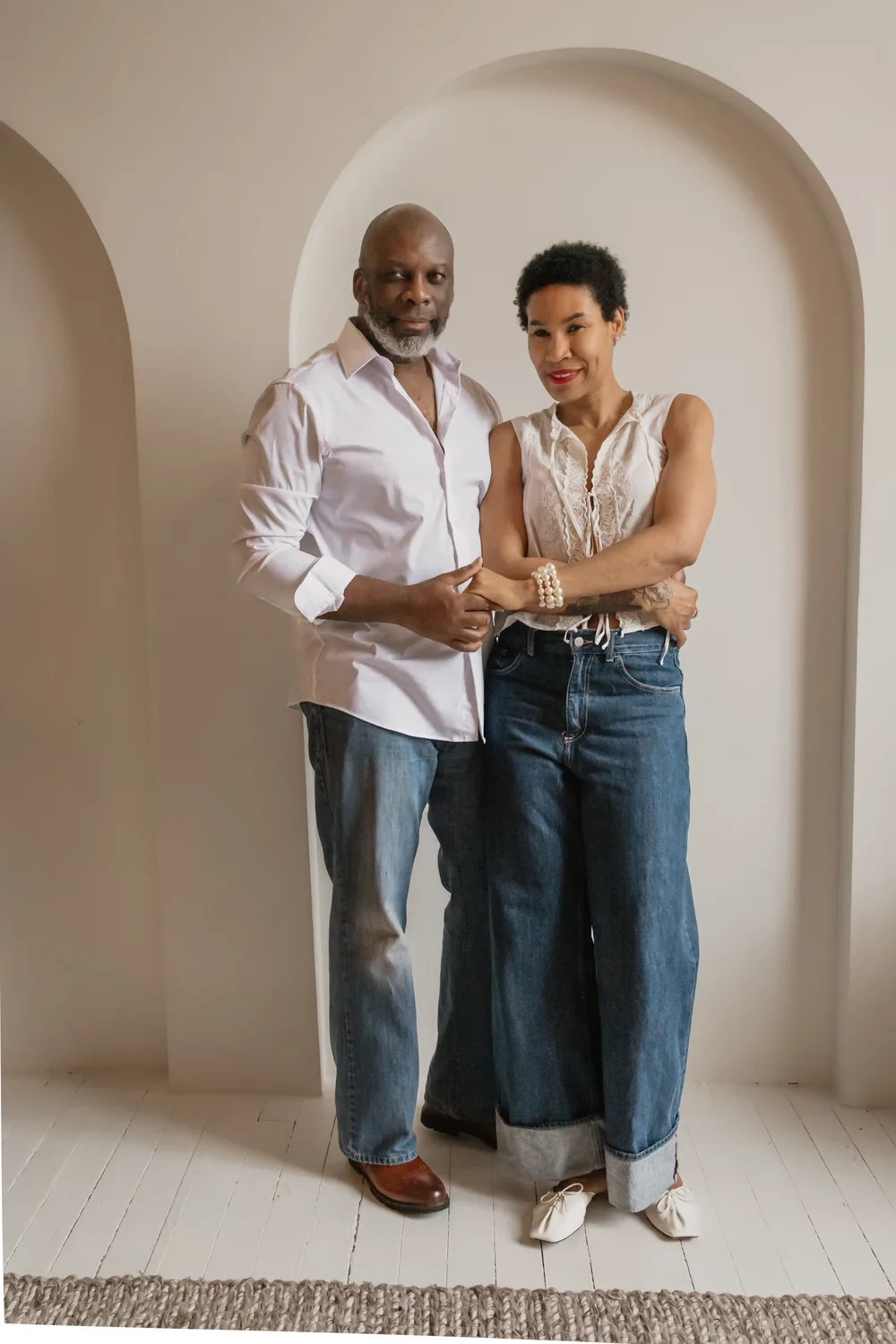 Couple together in a softly styled room