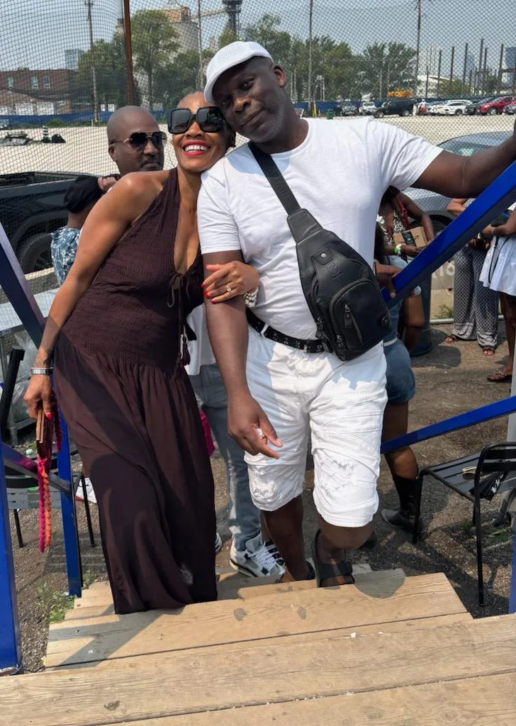 Couple smiling together at an outdoor event